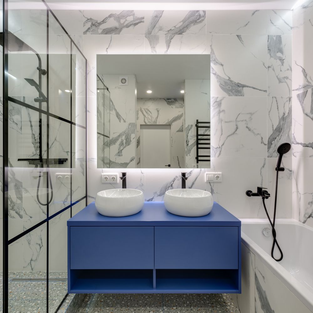 Semi-frameless glass shower partition with black frame